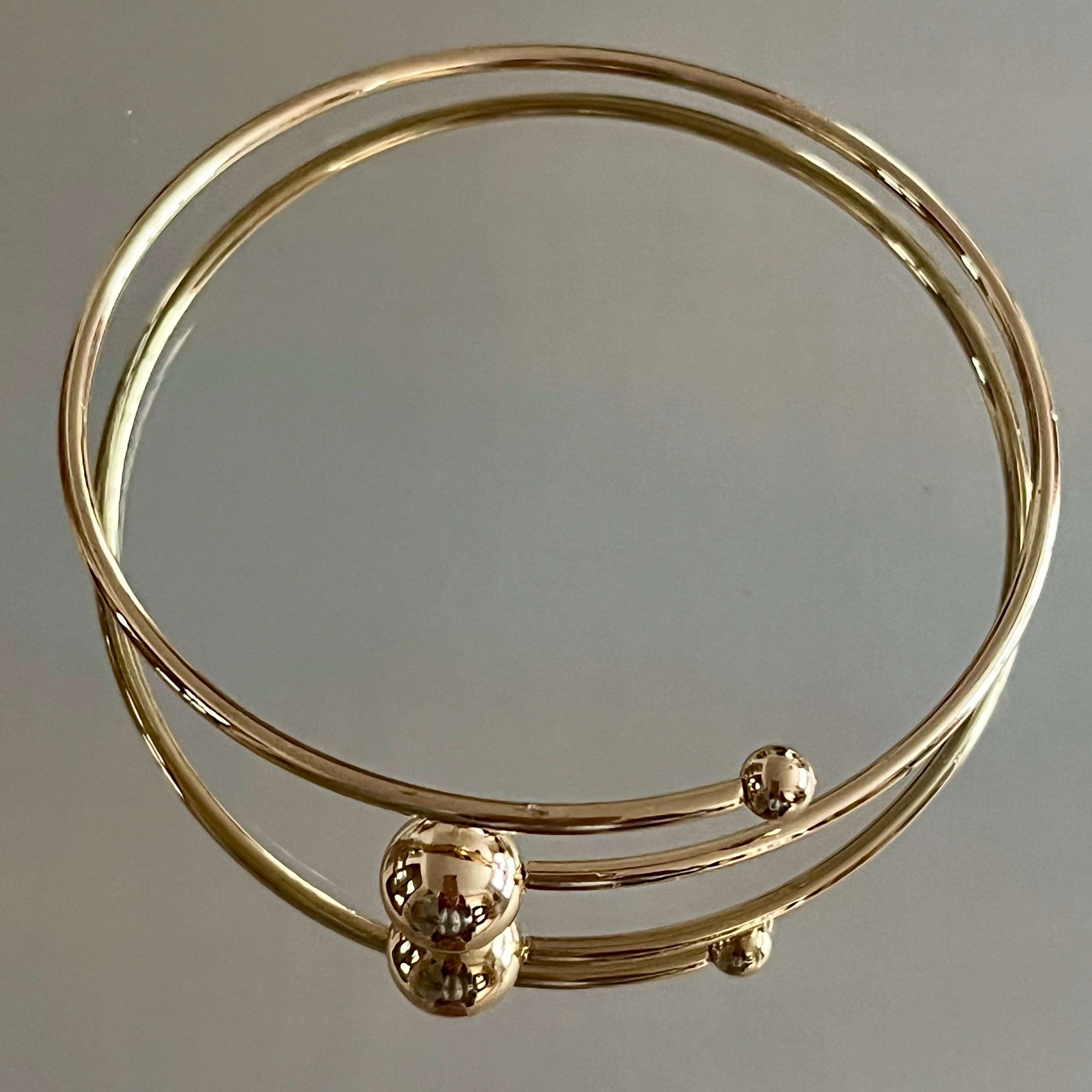 Orbit armband guld