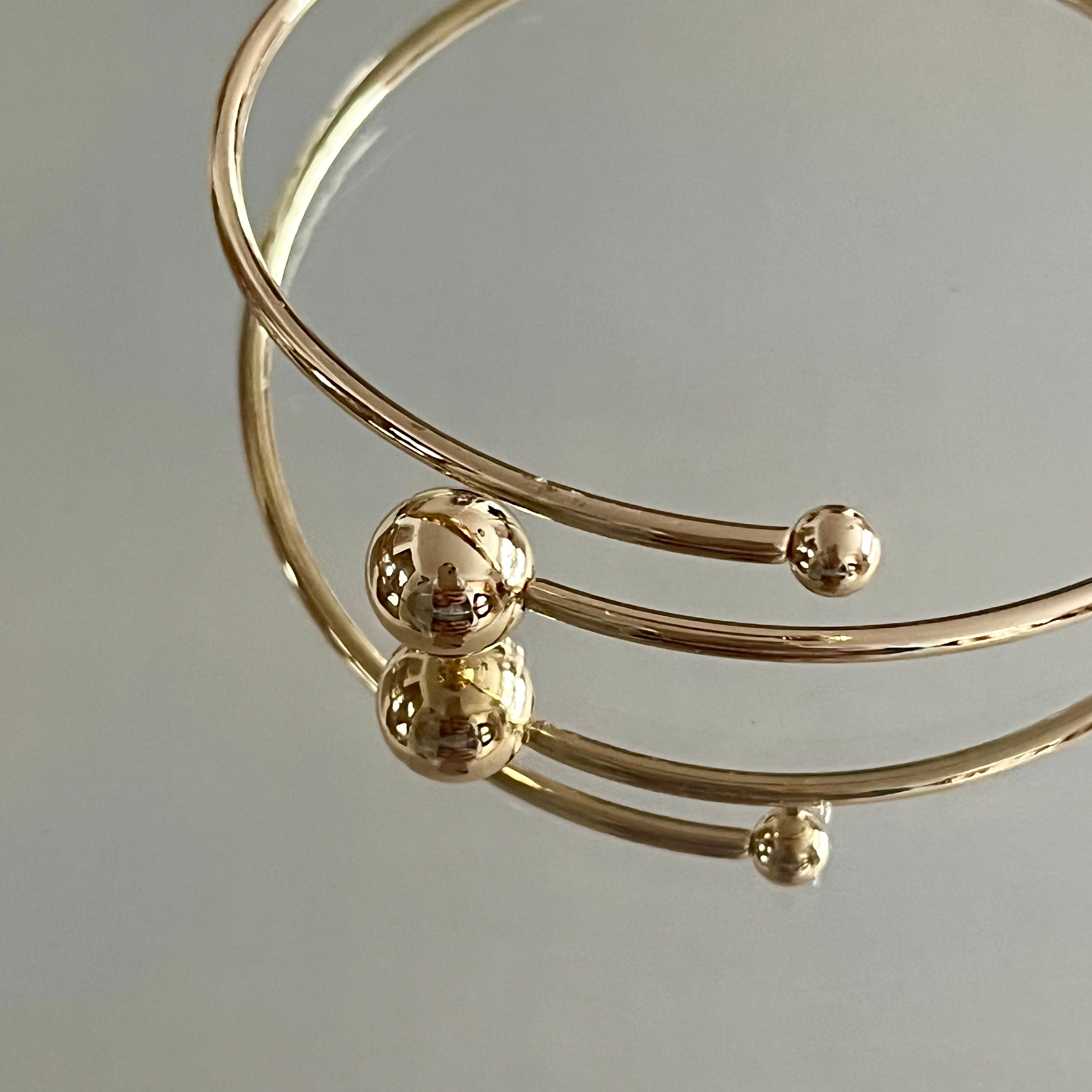 Orbit armband guld